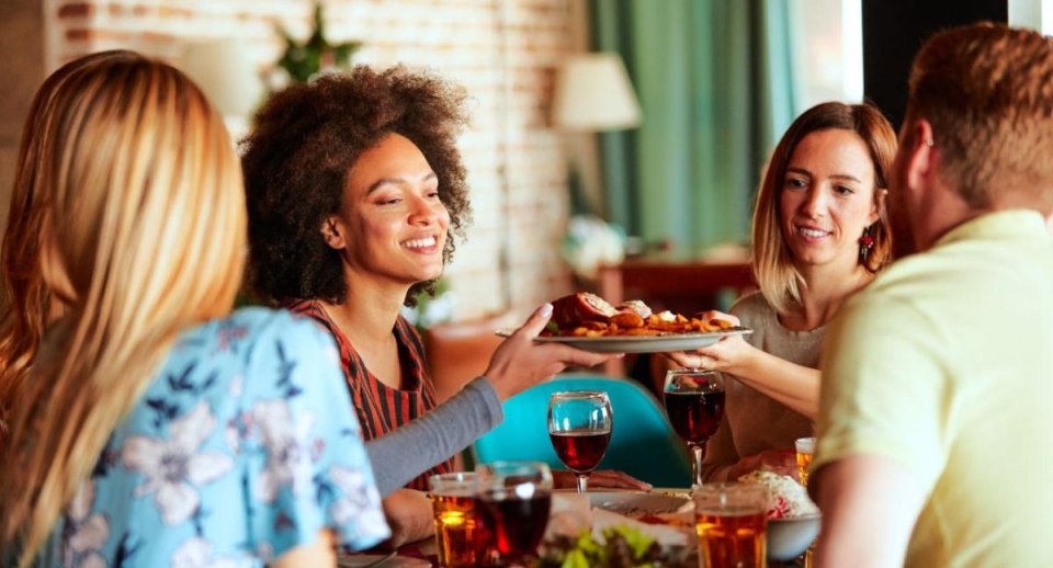 People having a dinner party at home