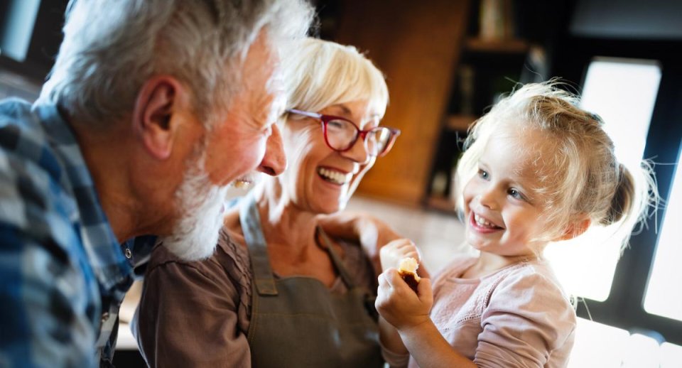 Grandparents with grandchild smiling