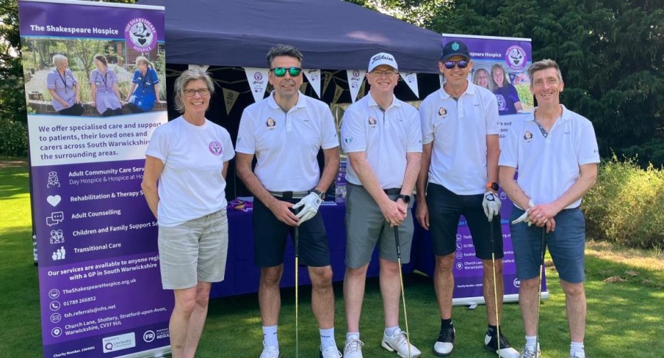 Golfers standing in front of The Shakespeare Hospice's gazebo with Trustee Nic Gotrel