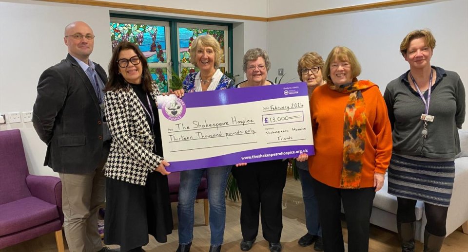 Golfers standing in front of The Shakespeare Hospice's gazebo with Trustee Nic Gotrel